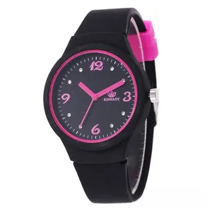 Macro detail of fashionable black and pink contrast silicone watch with rhinestone markers