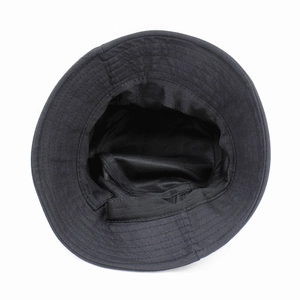 Detail view of cotton bucket hat interior with sweatband and premium stitching quality