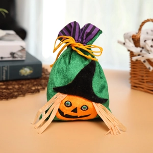 Green velvet Halloween pumpkin candy bag with orange face and black wizard hat design