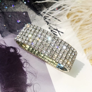 Macro shot of a wide silver-tone stretch bracelet featuring eight rows of sparkling rhinestones