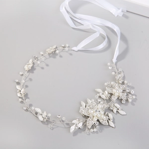 Detailed macro view of handcrafted silver bridal headband with pearls and rhinestones