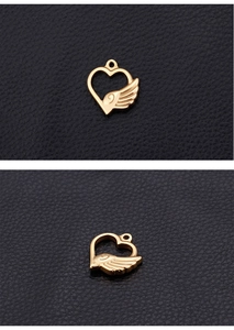 Detailed views of a gold heart wing pendant for DIY jewelry on black leather background