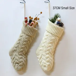 Set of two 37cm knitted Christmas stockings with cable pattern in beige and grey