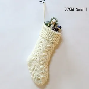37cm small white cable knit Christmas stocking with pine needles and pinecones
