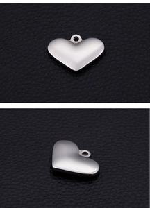 Macro view of a polished silver heart pendant for DIY necklaces and bracelets