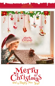 Christmas window stickers set featuring Santa, snowmen and festive gifts on glass surface