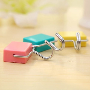 Colorful magnetic hooks for refrigerator, featuring pink, green, and yellow square bases