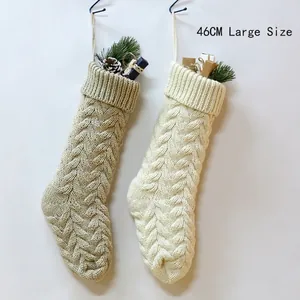 Set of two large 46cm knitted Christmas stockings in cream white and beige with rope loops