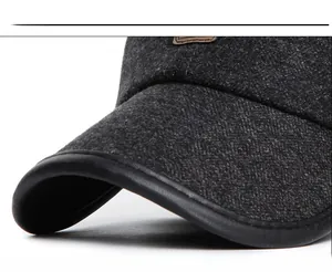 Macro shot of dark grey wool blend texture and premium leather piping on hat brim