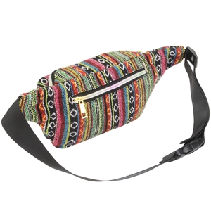 Detail of bohemian waist bag showing woven pattern, golden zipper, and nylon strap