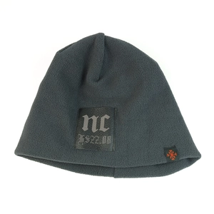 Close-up of thick fleece lining and black leather patch detail on the dark grey beanie