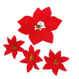 Vibrant red velvet artificial poinsettia flower heads for Christmas holiday decoration