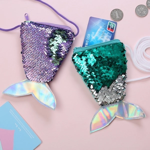 Detailed view of mermaid tail sequin coin purse with coins to show the small compact size