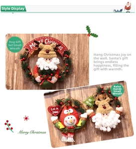 Detail of Christmas wreath with plush Santa and Snowman figures on natural rattan ring