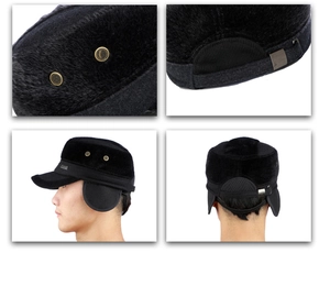 Detail of black winter hat with ear flaps, metal JEANS logo and adjustable back strap