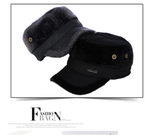 Close-up of thick winter military caps with faux fur lining and ear protection