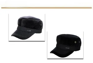 Close-up of winter flat top caps with ear protection and jeans label on the front