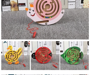 Detail of wooden magnetic labyrinth toys in snail, duck and fish cartoon animal shapes