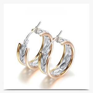 Detail of 304 stainless steel tri-color twisted hoop earrings with gold and silver finish