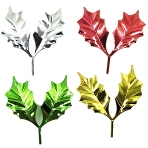 Golden and silver holly leaf Christmas cake toppers set in four metallic colors