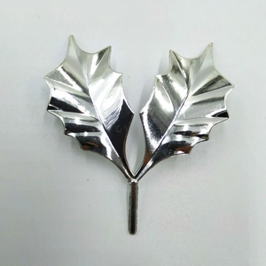 Detail of silver electroplated leaf insert for Christmas cake and festive bouquet decor