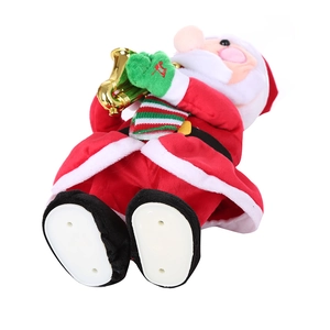 Electric Santa Claus toy playing golden saxophone with red scarf on white base