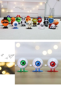 Detailed close-up of clockwork Halloween toys including jumping eyeballs and pumpkins