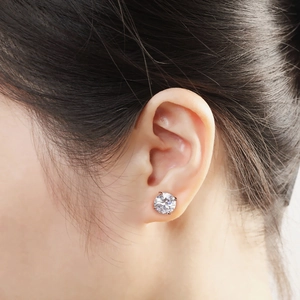 Classic four-prong stud earring with round cut cubic zirconia shown on model ear