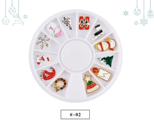 Macro shot of 12-grid nail art wheel with festive Christmas charms and zircon stones