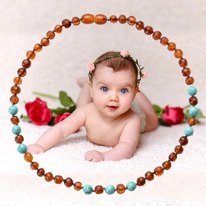 Baby Baltic amber and turquoise teething necklace featuring polished natural gemstone beads