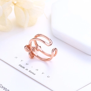Detailed macro shot of rose gold adjustable ring showing intricate hollow dot patterns