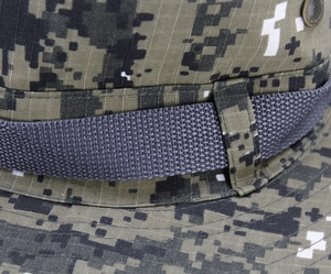 Macro shot of digital camo boonie hat featuring reinforced gray webbing and metal eyelets