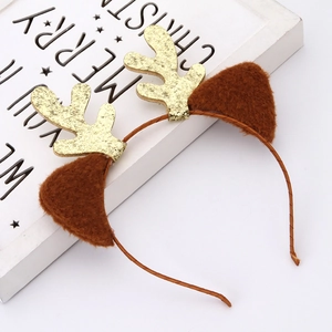 Christmas reindeer antler headband with golden sequins and brown plush ears on white background