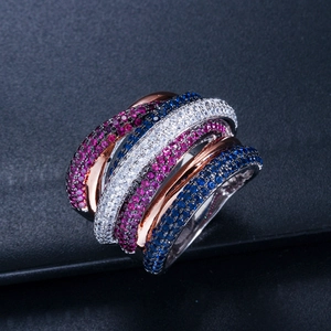 Macro detail of multi-row crisscross ring with pink, white and blue zircon micro-pave