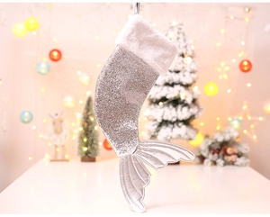 Detail view of silver sequin mermaid tail Christmas stocking with white faux fur trim decor