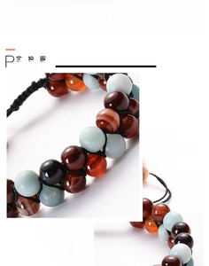 Detail of double-layer woven bracelet with lava stones and colorful 7 chakra beads