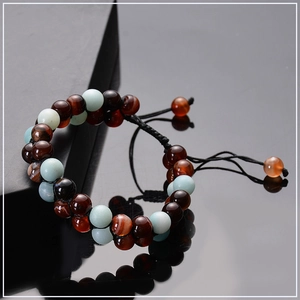 Close-up of double-layer volcanic lava and amazonite stone bracelet with adjustable cord