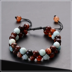 Macro view of double-layer lava stone and amazonite beaded bracelet with adjustable cord