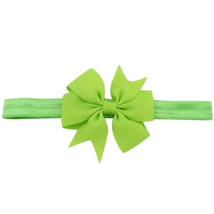 Neon green baby headband with a large ribbon fish-tail bow for infants and toddlers