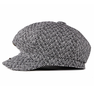 Classic herringbone knit newsboy hat in black and white tweed fabric with top button
