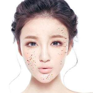 Detailed view of colorful facial glitter rhinestones applied on professional makeup look