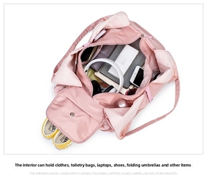 Detailed interior view of a pink travel bag showing organized compartments and large capacity