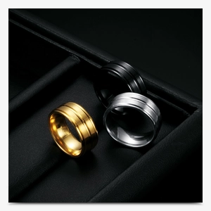 Detailed display of 8mm wide matte stainless steel rings in gold, silver, and black colors
