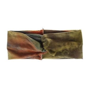 Close-up of bohemian tie-dye knotted headband with earth tone elastic fabric texture