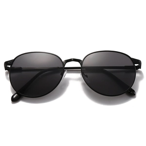 Retro oval black metal sunglasses with dark gray lenses and spring hinges for fashion