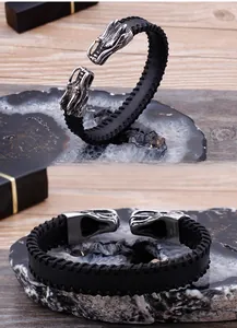 Detailed close-up of woven leather men's dragon head bracelet with 316L stainless steel clasp