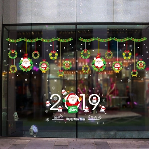 Christmas wreath and Santa glass window stickers for festive shopfront holiday decoration