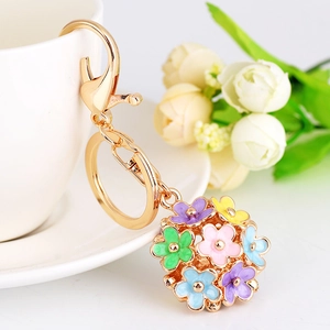 Exquisite floral ball keychain with multicolored enamel daisy petals on a gold-tone chain