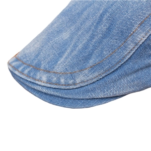 Light blue washed denim beret cap featuring contrast orange stitching details