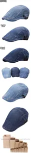 Detail view of washed denim beret featuring adjustable metal buckle and contrast stitching